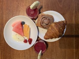 wellness juice, delectable home-made cinnamon scroll and croissant