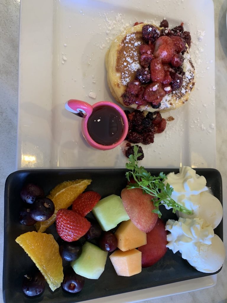 Fruit pancakes with compote and fruit platter
