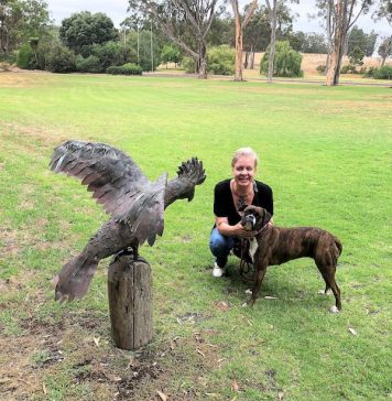 Helen Ganska and Betty the Boxer chat to a cockatoo at West Cape Howe in Mt Barker